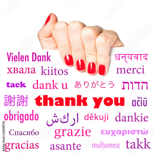 Photo: Hand holding card with the word "thank you" in many languages Hand holding card with the word "thank you" in many languages