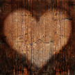 Heart on weathered timber wall