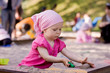 little girl in sandbox