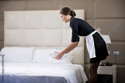 Photo: Maid Making Bed Maid Making Bed