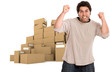 Strong angry man and piles of boxes