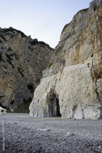 Photo: Cavernous rock on a pebbly beach, Camerota, Italy Cavernous rock on a pebbly beach, Camerota, Italy
