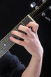 Human hand taking C-major accord at guitar Human hand taking C-major accord at guitar