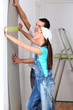 Young couple choosing color of wallpaper