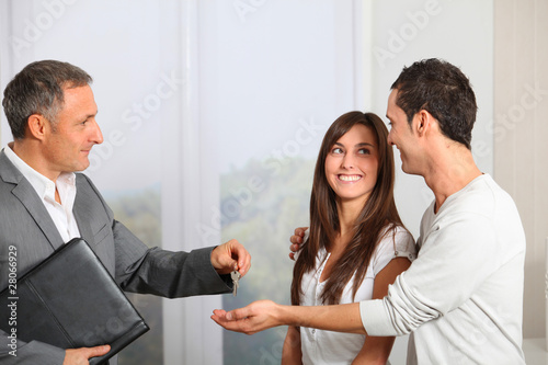 Photo: Young couple buying new home Young couple buying new home