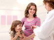 Photo: Female doctor examining little girl. Female doctor examining little girl.