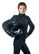 Young woman in motorcycle clothing holding a helmet