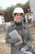 Woman engineer helmet standing on construction site