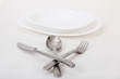 Foto: fork and knife and spoon and white plates fork and knife and spoon and white plates