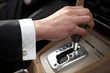 Hand of the driver of the car