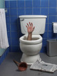 Photo: Hand reaches up through the seat from out of a toilet. Hand reaches up through the seat from out of a toilet.