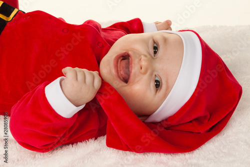 Photo: Kleines Baby als Weihnachtsmann Kleines Baby als Weihnachtsmann