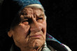The sad, old woman, looking away, isolated The sad, old woman, looking away, isolated