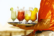 Photo: Waiter serving drinks / cocktails on the beach Waiter serving drinks / cocktails on the beach