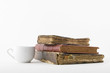 Coffee cup and three old book Coffee cup and three old book