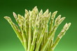 Sheaf of asparagus on a green background. Sheaf of asparagus on a green background.