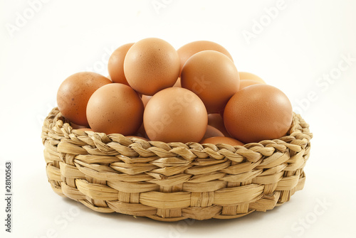 Photo: Basket with colored eggs Basket with colored eggs