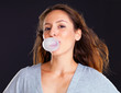 Woman blowing a bubble with bubble gum