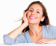 Happy woman resting with her head on hand