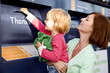 A mother and daughter recycling clothes