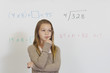 Pensive Schoolgirl against whiteboard