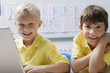 Schoolboys Using a Laptop