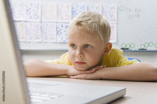 Photo: Schoolboy Using a Laptop Schoolboy Using a Laptop