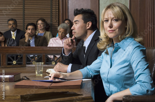 Photo: Defense lawyer with client in court Defense lawyer with client in court