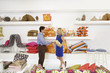 Salesman in Home Furnishings Store Shaking Customer's Hand