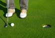 Golf green hole course man putting short ball Golf green hole course man putting short ball