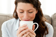 Cute businesswoman enjoying her coffee at home Cute businesswoman enjoying her coffee at home