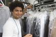 Portrait of young man working in dry cleaners