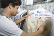 Young man working in dry cleaners