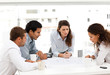 Four charismatic architects looking at plans together