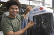 Portrait of young man working in dry cleaners
