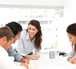 Happy female architect with her team during a meeting
