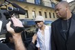 Male celebrity being interviewed by paparazzi