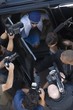 Male celebrity and paparazzi, high angle