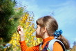The girl against autumn wood
