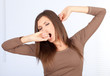 standing beautiful woman yawning and stretching