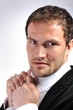 Foto: Detail of a man, fixing his tie Detail of a man, fixing his tie