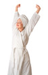 Woman in bathrobe is stretching Woman in bathrobe is stretching