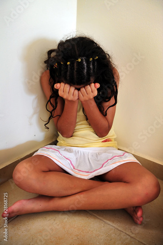 Photo: Young Girl Suffers from Domestic Violence Young Girl Suffers from Domestic Violence