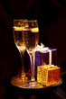 Christmas gift box with glasses of champagne
