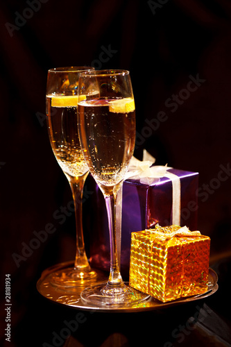 Photo: Christmas gift box with glasses of champagne Christmas gift box with glasses of champagne