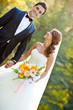 happy bride and groom at a park on their wedding day