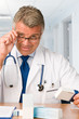 Mature doctor with medicines