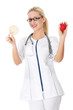 Beautiful blond female doctor holding rice cake