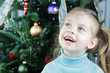 Child by the Christmas Tree
