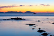 sunrise on rocky sea coast